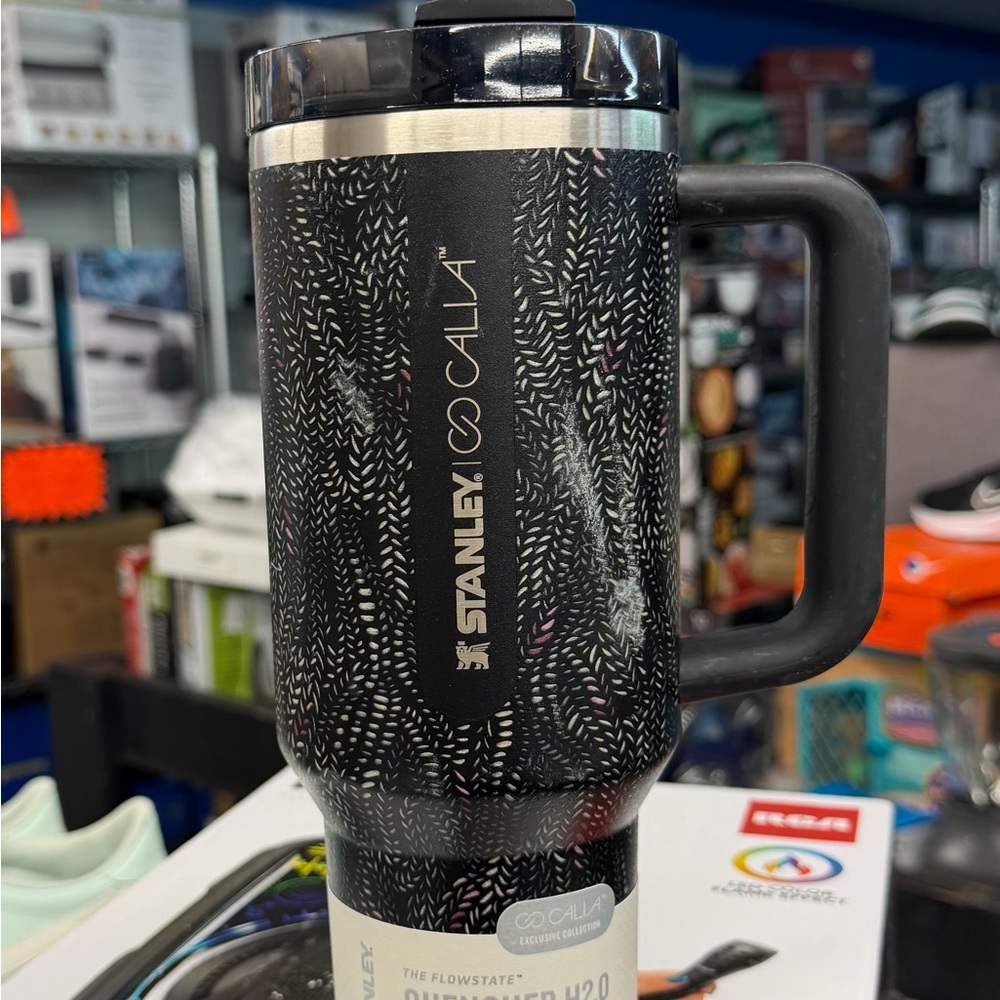 Stanley 30 oz. IceFlow Flip Straw Tumbler. 
Stanley Black & Silver Insulated Mug